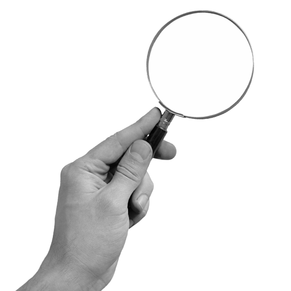 Hand holding magnifying glass