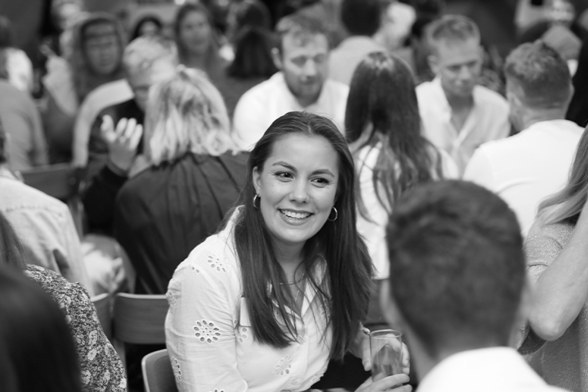 People setting talking happily to each other